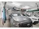 Spacious garage featuring storage racks, ample parking, and room for bikes and kayaks at 5656 Cantucci St, Nokomis, FL 34275