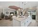 Bright open kitchen, offering pendant lights, stainless appliances and lots of counter seating at 5656 Cantucci St, Nokomis, FL 34275