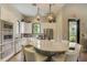 Modern kitchen area with large island, stainless appliances, and hardwood floors at 5656 Cantucci St, Nokomis, FL 34275
