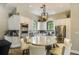 Features an island and stainless-steel appliances, creating a modern, luxurious space at 5656 Cantucci St, Nokomis, FL 34275