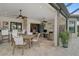 Expansive screened lanai boasts a built-in bar, dining area, comfortable seating and views of the lush landscaping at 5656 Cantucci St, Nokomis, FL 34275