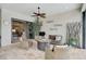 Relaxing patio with comfortable seating, ceiling fan, and access to indoor living area at 5656 Cantucci St, Nokomis, FL 34275