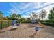 Community playground featuring slide, swing, and other play structures at 5656 Cantucci St, Nokomis, FL 34275
