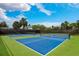 Well-maintained tennis courts with green and blue surfaces under a sunny sky at 5656 Cantucci St, Nokomis, FL 34275
