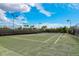 Enjoy a match on this outdoor tennis court with well-maintained surface and lighting for evening games at 5656 Cantucci St, Nokomis, FL 34275