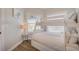 Bright bedroom featuring built-in bunk beds, wood-look flooring, and a light, airy atmosphere at 5708 Holmes Blvd, Holmes Beach, FL 34217