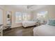 Sunny bedroom with two twin beds, stylish decor and an abundance of natural light at 5708 Holmes Blvd, Holmes Beach, FL 34217