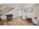 Recreation room with a Foosball table, stairs, and comfortable seating at 5708 Holmes Blvd, Holmes Beach, FL 34217
