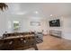 Recreation room with a Foosball table, TV, and comfortable seating at 5708 Holmes Blvd, Holmes Beach, FL 34217