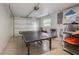 Spacious garage features an epoxy floor, a ping pong table, and ample storage space at 5708 Holmes Blvd, Holmes Beach, FL 34217