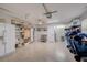 Organized garage space with shelving, a refrigerator, and ample room for storage and recreation at 5708 Holmes Blvd, Holmes Beach, FL 34217