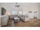 Comfortable living room with stylish furniture, wood floors, and plenty of natural light at 5708 Holmes Blvd, Holmes Beach, FL 34217