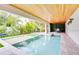 Stunning pool area with built-in spa and covered patio, perfect for outdoor entertaining at 5708 Holmes Blvd, Holmes Beach, FL 34217