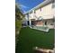 Stunning backyard pool with a manicured lawn perfect for relaxing and entertaining guests at 5708 Holmes Blvd, Holmes Beach, FL 34217