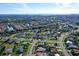 Beautiful aerial view showcases the property's location within a serene neighborhood near a lake at 6684 Easton Dr, Sarasota, FL 34238
