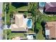 Aerial view of home, highlighting its private backyard with a sparkling pool and lush landscaping at 6684 Easton Dr, Sarasota, FL 34238