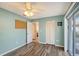 An additional bedroom featuring wood floors, bright light and a large glass sliding door to outside at 6684 Easton Dr, Sarasota, FL 34238