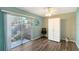 Bright bedroom with a large sliding door that opens to a private outdoor space at 6684 Easton Dr, Sarasota, FL 34238