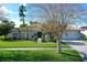 Charming single-Gathering home with a well-maintained lawn, mature trees, and inviting curb appeal at 6684 Easton Dr, Sarasota, FL 34238