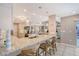 Bright, open kitchen with a large island, bar seating, and easy access to the living areas at 6684 Easton Dr, Sarasota, FL 34238
