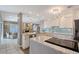 Updated kitchen with stainless steel appliances, granite countertops, and glass tile backsplash at 6684 Easton Dr, Sarasota, FL 34238