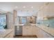 Bright open kitchen featuring stainless steel appliances, attractive backsplash, and seamless access to living areas at 6684 Easton Dr, Sarasota, FL 34238