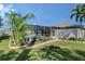 Inviting pool area surrounded by lush landscaping and a screened-in enclosure for outdoor living at 6684 Easton Dr, Sarasota, FL 34238