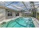 A stunning backyard pool is surrounded by a screened enclosure, offering both privacy and protection at 6684 Easton Dr, Sarasota, FL 34238