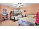 Charming bedroom features a bunk bed, full bed, and a cozy atmosphere for children at 6900 Country Lakes Cir, Sarasota, FL 34243