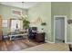 Bright dining area featuring a dining table, chandelier, desk, and plenty of natural light at 6900 Country Lakes Cir, Sarasota, FL 34243