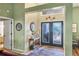 Entryway showcasing a foyer with decorative glass double doors and neutral tones at 6900 Country Lakes Cir, Sarasota, FL 34243