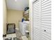 Bright laundry room with a washer, dryer, storage cabinets, and space for a dog kennel at 6900 Country Lakes Cir, Sarasota, FL 34243