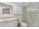 Updated bathroom featuring marble countertops, glass-enclosed shower, and modern finishes at 800 Hudson Ave # 102, Sarasota, FL 34236