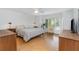 Bright bedroom with large windows and wood-look floors, creating a warm and inviting atmosphere at 800 Hudson Ave # 102, Sarasota, FL 34236