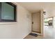 Inviting entryway featuring unit number, exterior lighting, and covered walkway at 800 Hudson Ave # 102, Sarasota, FL 34236