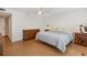 Bright main bedroom with wood floors, ceiling fan, and furniture at 800 Hudson Ave # 102, Sarasota, FL 34236