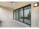 Enclosed patio offers privacy and extended living space, featuring tiled flooring and ample natural light at 800 Hudson Ave # 102, Sarasota, FL 34236