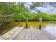 Community boat dock with calm water, easy access to waterways, and serene surroundings at 803 Audubon Dr # 803, Bradenton, FL 34209