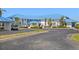 Well-maintained building exterior with a parking lot and manicured landscaping at 803 Audubon Dr # 803, Bradenton, FL 34209