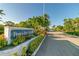 Welcoming entrance to Perico Bay Club with manicured landscaping and a clear roadway at 803 Audubon Dr # 803, Bradenton, FL 34209