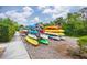 Outdoor storage rack filled with colorful kayaks and canoes for residents to enjoy at 803 Audubon Dr # 803, Bradenton, FL 34209