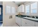 Bright kitchen featuring white cabinets, stainless steel appliances, and ample counter space at 803 Audubon Dr # 803, Bradenton, FL 34209