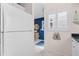 Modern kitchen features a large refrigerator and a view to another room at 803 Audubon Dr # 803, Bradenton, FL 34209