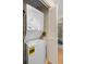 A compact laundry area with a stacked washer and dryer, maximizing space and efficiency at 803 Audubon Dr # 803, Bradenton, FL 34209