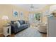 Comfortable living room with a sofa and a view of the outside at 803 Audubon Dr # 803, Bradenton, FL 34209