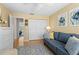 Comfortable living room with a sofa and a view of the hallway at 803 Audubon Dr # 803, Bradenton, FL 34209