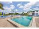Beautiful community pool with plenty of lounge chairs and lush landscaping with an inviting atmosphere at 803 Audubon Dr # 803, Bradenton, FL 34209