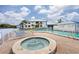 Community pool and hot tub with plenty of lounge chairs with beautiful views of the surrounding landscape at 803 Audubon Dr # 803, Bradenton, FL 34209