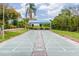 Outdoor shuffleboard court with shading structure and seating for relaxing play at 803 Audubon Dr # 803, Bradenton, FL 34209
