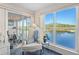 Comfortable sitting area with views of the water and access to the lanai at 803 Audubon Dr # 803, Bradenton, FL 34209